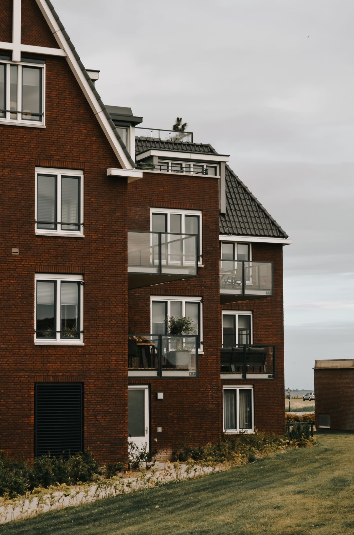 Modern residential facades with balconies and large windows