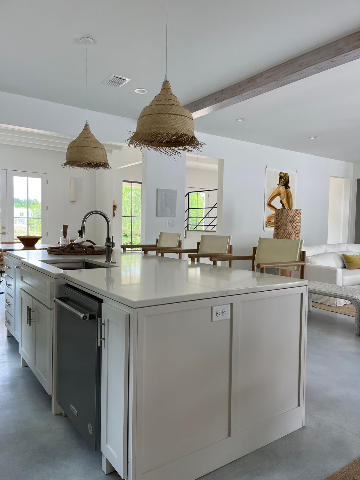 Bright modern kitchen with island and pendant lights