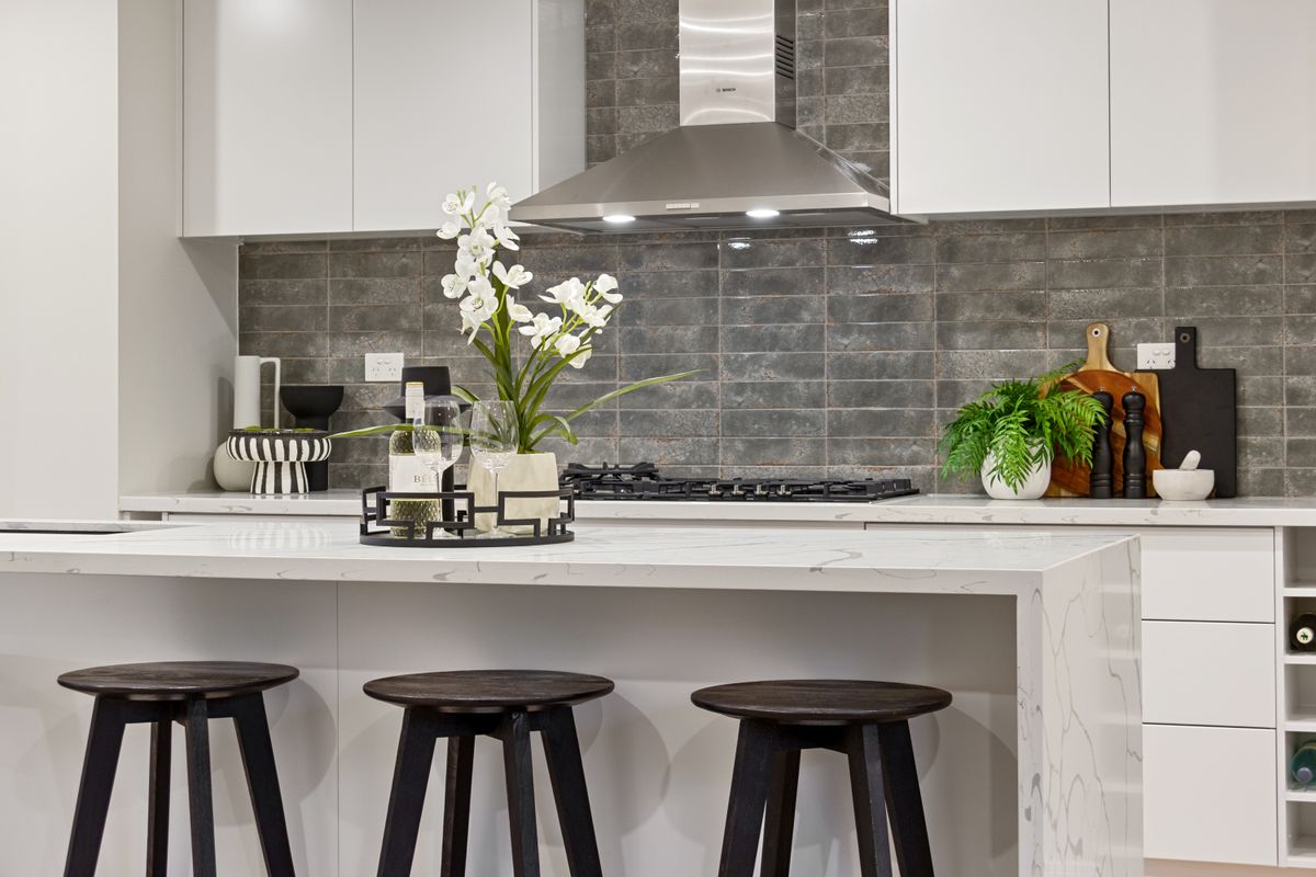 Contemporary kitchen with a light stone island