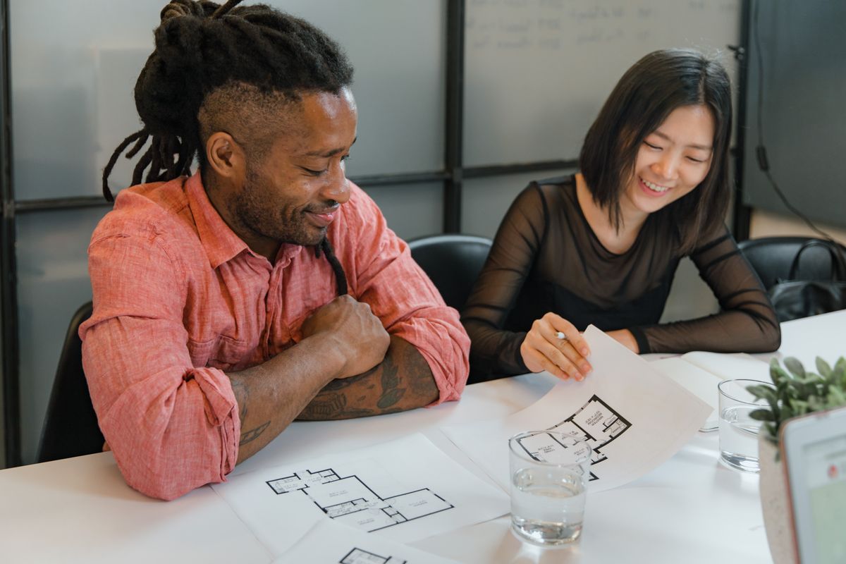 Team reviewing architectural plans in an office