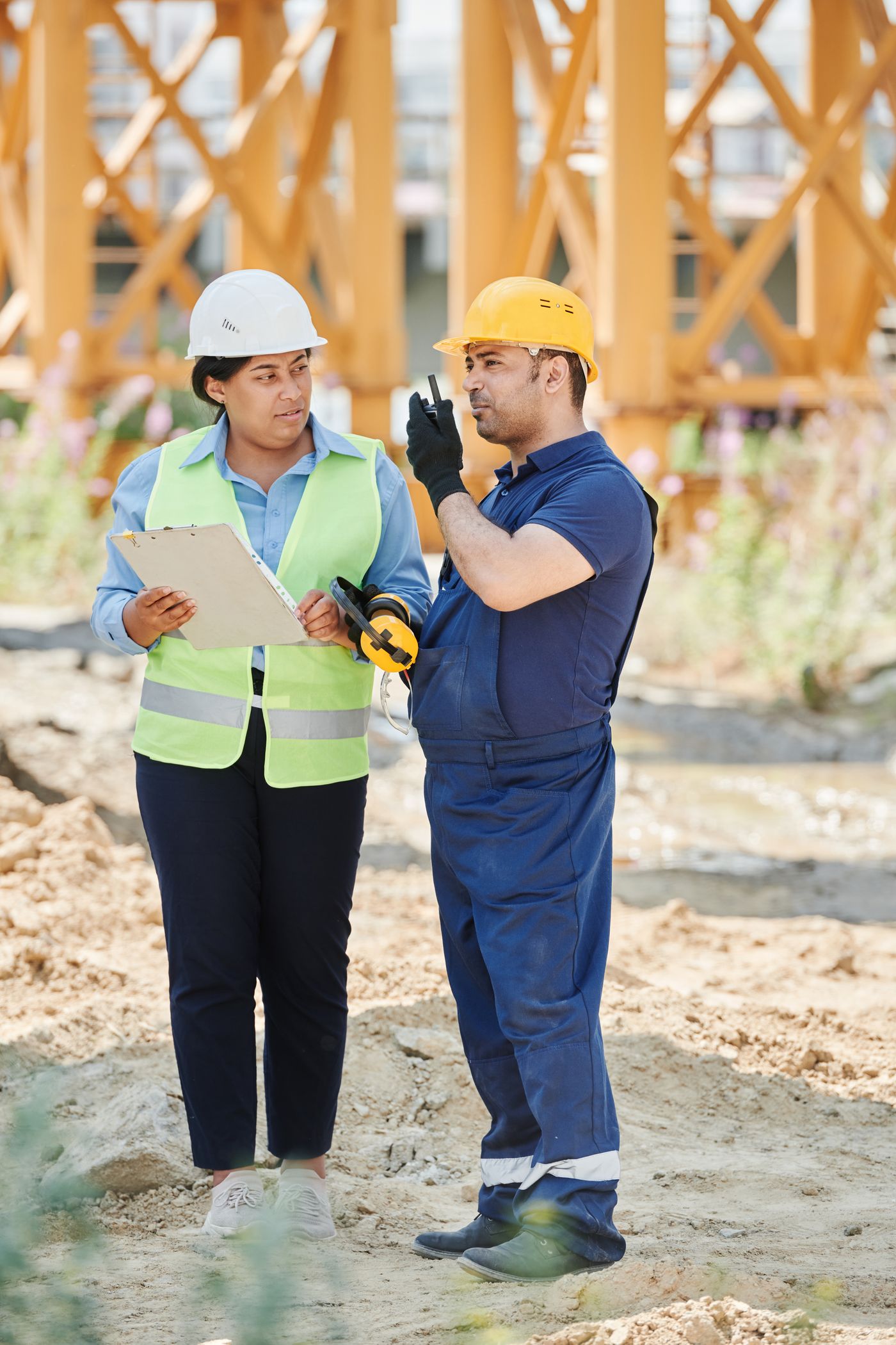 Construction professionals discussing work on site